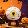 Detailansicht einer gruseligen Plüsch-Augapfel-Puppe mit Halloween-Dekorationen - Hellgelb / 15cm