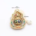 Close-up of rotatable golden hulu pendant featuring colorful Six-Syllable Mantra enamel - Hollow Rotatable Mantra Gourd Pendant (GF-355) / Style 1