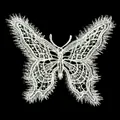 Detailed macro view of an intricate white butterfly lace embroidery applique patch on black - Butterfly 2# (White Tassel Butterfly)