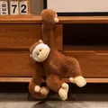 Cute brown long-arm monkey plush toy hanging on a wooden cabinet, perfect gift for kids. - 25cm / Brown