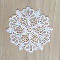 Detailed view of the intricate white hollow floral embroidery on a vintage lace patch - 10cm / 15# (Symmetrical Snowflake Floral)