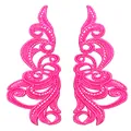 Macro view of symmetrical pink lace embroidery patches with intricate hollow design - Rose Red
