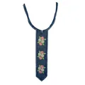 Macro detail view showing rose floral embroidery on navy blue lace neck collar. - Dark Blue