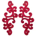 Close-up of symmetrical red embroidered lace floral patches for DIY sewing projects - Burgundy