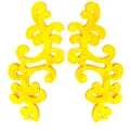 Macro detail of yellow symmetrical scroll embroidery lace applique for DIY sewing. - Yellow