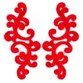 Detailed macro view of red symmetrical water-soluble embroidered lace floral appliques - Red