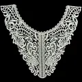 Detailed view of intricate white water-soluble lace embroidery on milk silk collar - White