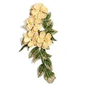 Close-up of 3D embroidered floral lace patch with cream flowers and green leaves - Beige