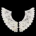 Detailed view of white cotton lace collar with intricate floral embroidery - Apricot