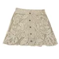 Detailed view of a beige crochet A-line mini skirt with floral embroidery and buttons. - One Size / Bottoms