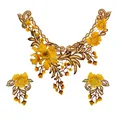 Close-up of golden yellow floral lace embroidery with intricate ethnic thread detailing. - Three-Piece Set / Yellow