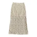 Detailed view of cream-colored crochet maxi skirt featuring hollow-out lace patterns - One Size / Bottoms / Apricot