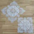 Set of white embroidered lace placemats with elegant hollow-out floral design on wooden surface - Diameter 30cm / White