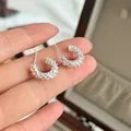 Macro detail of elegant s925 sterling silver textured lace-edge C-shaped stud earrings - Lace Edge C-Shape Earrings (E8461)