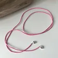 Detail of pink suede cord necklace featuring silver heart charms for multi-style wear - 925 Silver / Dusty Pink
