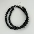 Detailed view of polished black onyx beads and s925 sterling silver clasp. - 925 Silver / 6mm
