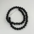 Detail of black onyx bead necklace featuring a polished S925 sterling silver clasp. - 925 Silver / 8mm