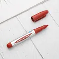Professional red oil-based permanent marker with a silver barrel and matching cap - Red