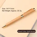 Elegant wooden ballpoint pen with polished gold brass accents in natural finish - White Wood Gold Accessories