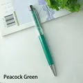 Elegant peacock green crystal ballpoint pen featuring a rhinestone filled top design - Malachite green