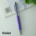Elegant violet metal ballpoint pen featuring clear barrel filled with purple crystals - Violet