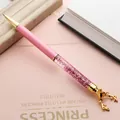 Creative pink glitter liquid ballpoint pen featuring a golden reindeer head charm - Pink