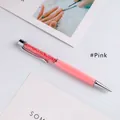 Elegant pink ballpoint pen featuring a crystal-filled upper barrel and silver metallic trim - Pink