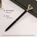 Elegant black metal ballpoint pen featuring a large faceted crystal diamond on top - Black