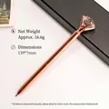 Elegant rose gold metal ballpoint pen with a large sparkling clear diamond crystal top - Rose Gold