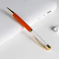 Elegant orange and clear barrel DIY ballpoint pen featuring golden metal trim and top gem - Orange