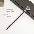 Elegant silver metal ballpoint pen featuring a large faceted crystal diamond topper for gifts - Silver