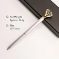 Elegant silver metal ballpoint pen featuring a large crystal diamond top and gold trim - Matte Silver