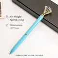 Elegant light blue ballpoint pen featuring a large crystal diamond top and gold metal accents - Sky Blue