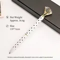 Elegant white ballpoint pen with black polka dots and a large crystal diamond top - White with Black Dots