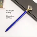 Luxury blue metal ballpoint pen with a large crystal diamond and elegant gold claw setting - Sapphire Blue