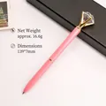 Elegant pink metal ballpoint pen featuring a large crystal diamond topper for gifting - Pink