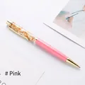 Elegant twist ballpoint pen featuring gold foil flakes and a sleek pink barrel - Pink