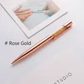 Elegant rose gold metallic ballpoint pen with orange crystal accents for luxury gifts. - 1.0mm Black Ink / Rose Gold