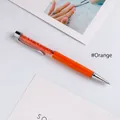 Orange crystal ballpoint pen with sparkling rhinestones inside a transparent barrel - Orange