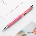 Elegant pink metal ballpoint pen featuring sparkling crystals in a clear barrel - 1.0mm Bullet Tip Black Ink / Pink