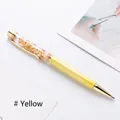 Elegant yellow metal ballpoint pen featuring decorative floating gold foil flakes - Yellow