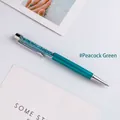 Elegant peacock green metal ballpoint pen filled with shimmering decorative crystals - Peacock Green
