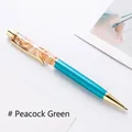 Elegant peacock green metal ballpoint pen with luxury gold foil in clear oil - Malachite green