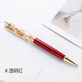 Metallic red gold foil floating ballpoint pen with transparent top and gold accents. - Transparent Red