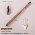 Professional French tip nail art brush with amber handle and ultra-fine fiber bristles. - 04 French Nail Art Brush / Single Pack