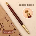Premium rosewood and brass signature pen featuring a Chinese Zodiac Snake design - Dalbergia-Snake