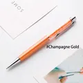 Elegant champagne gold metal ballpoint pen filled with sparkling orange crystals - 1.0mm Bullet Tip Black Ink / Champagne