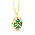 Close-up of vintage oval enamel locket pendant with pearl and rhinestone star design - Pink Base Green Star Locket (AC133)
