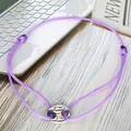 Close-up detail of purple adjustable cord friendship bracelet with silver pig nose charm - Pig Nose Woven Bracelet / Purple-Silver Plated-Double Cord