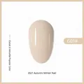 Glossy creamy nude milk tea nail gel polish swatch G01# presented on almond nail tip - 01# Caramel Cocoa (Milk Tea G01#)